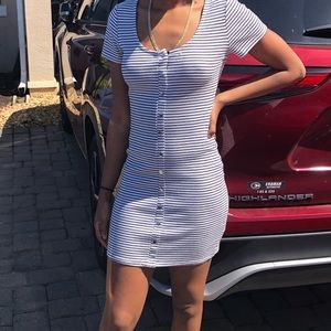 Beautiful spring or summer dress fits medium and small. A cute throw on dress